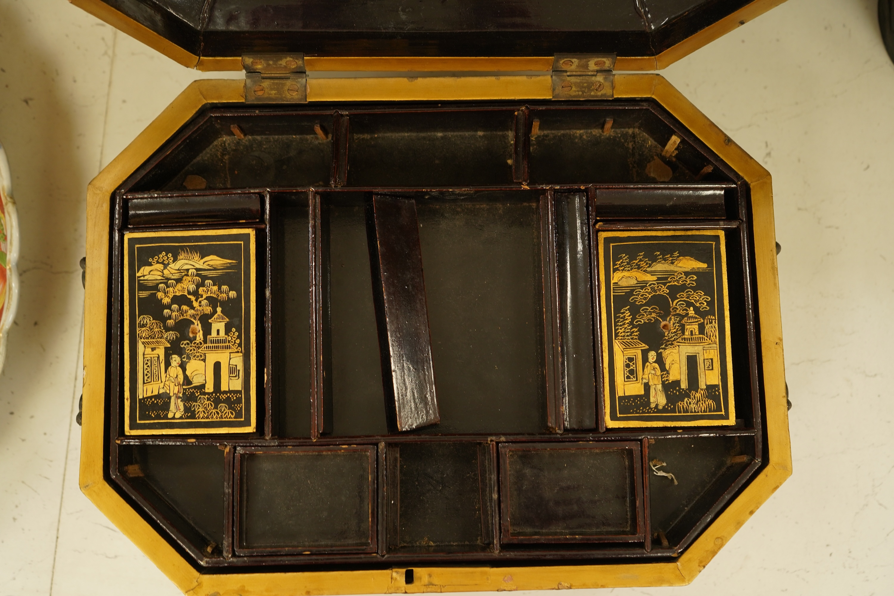 A Chinese export octagonal lacquered work box with fitted interior, 35cm wide